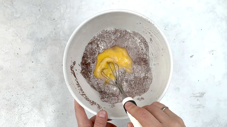 whisking eggs in dry ingredients