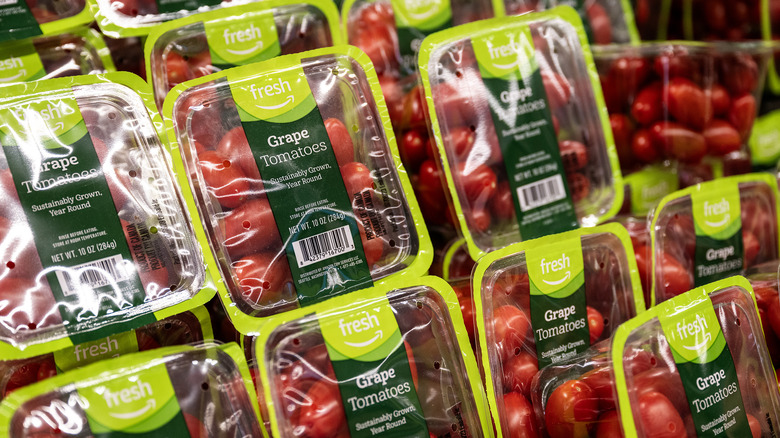 Packages of Amazon Fresh cherry tomatoes