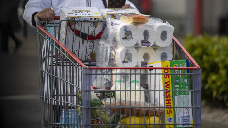 Person pushing grocery cart