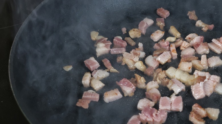 skillet of cooking pancetta