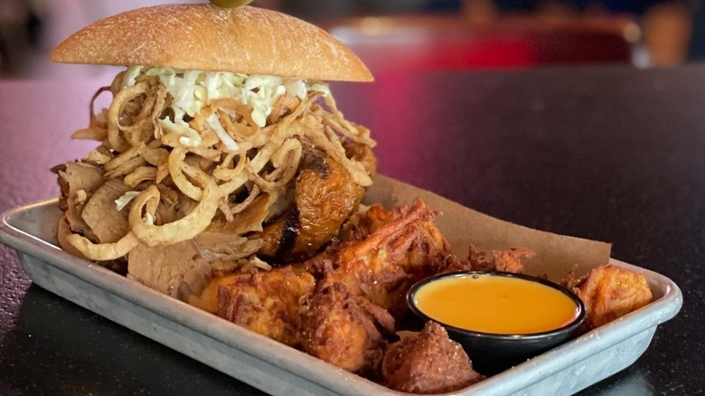 platter with Austin brisket sandwich and tots