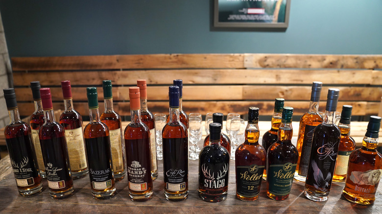 bottles of bourbon lined up on a table