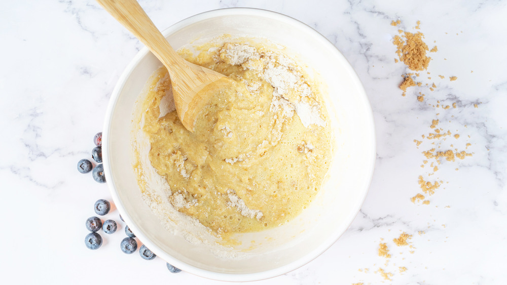 mixing blueberry muffin batter