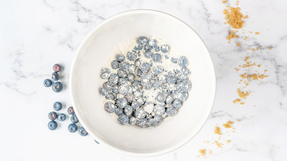 blueberries in flour for blueberry muffins