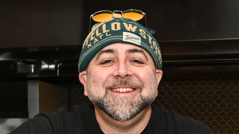 Duff Goldman smiling in green beanie