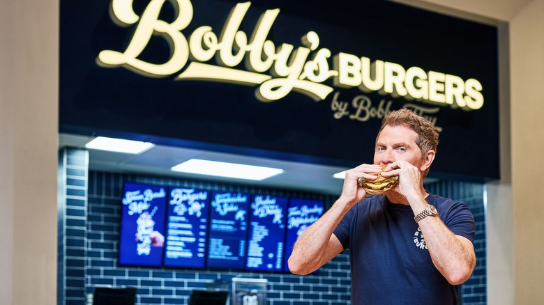 Bobby Flay eating burger