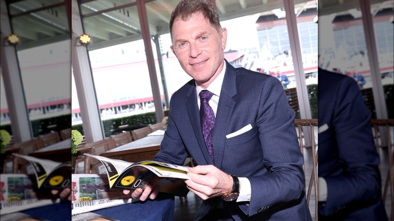 Bobby Flay seated at table