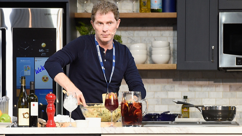 Bobby Flay mixing a bowl