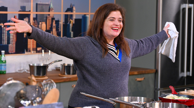 Alex Guarnaschelli looking happy with her arms spread wide