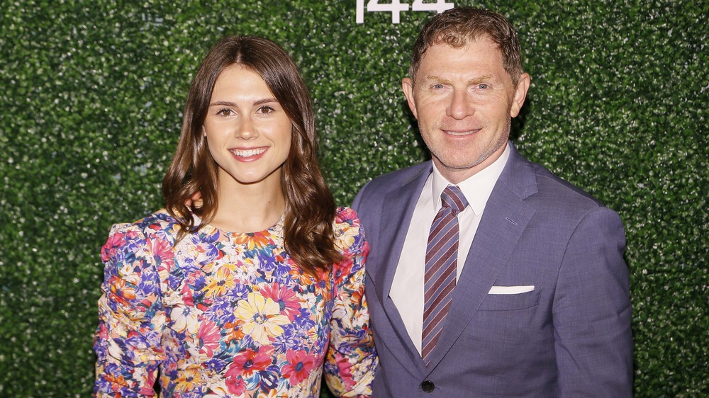 bobby and sophie flay standing in front of green background