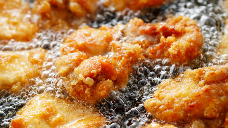 chicken frying in oil