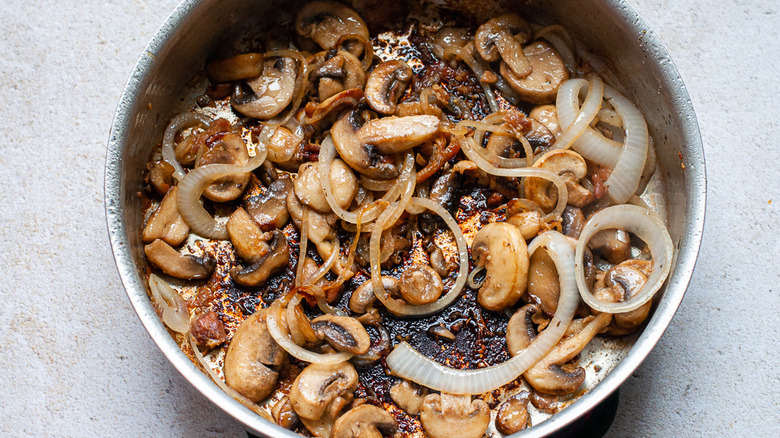 mushrooms and onions in pan