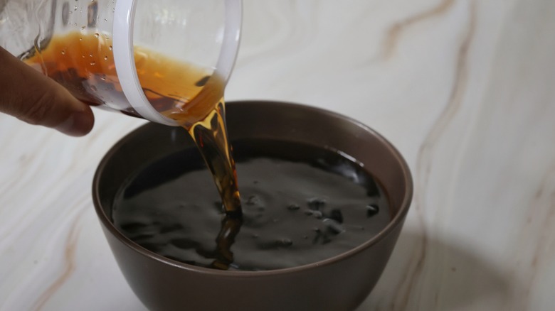 pouring coffee liqueur into bowl