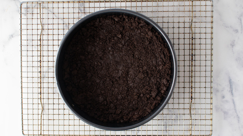 cookie crumb crust in pan on cooling rack