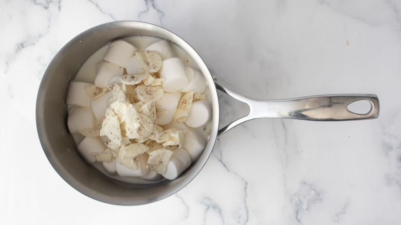 milk and marshmallows in pan