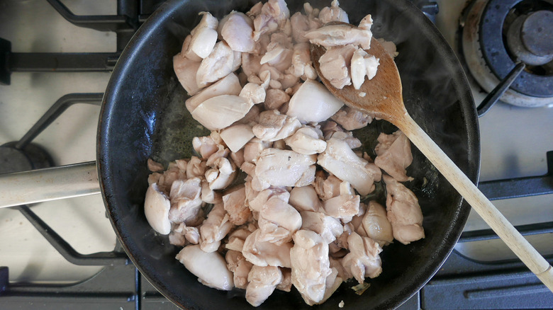 chicken cooking in skillet