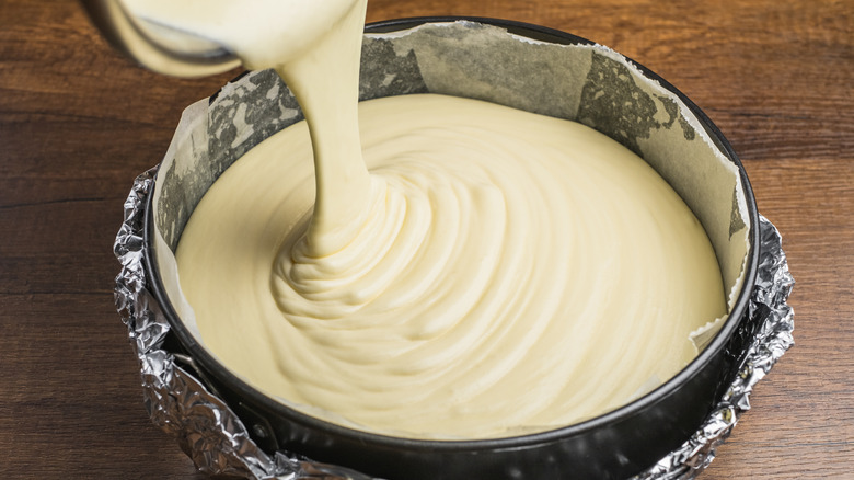 Cake batter poured into tin