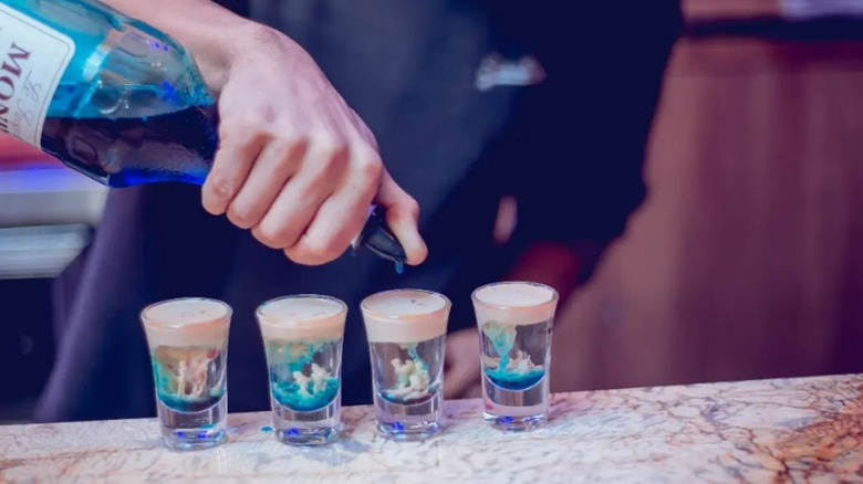 Bartender pouring alien brain hemorrhage shot