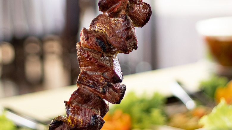 pieces of filet mignon on a skewer