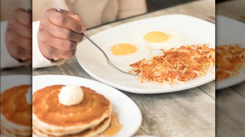 person eating breakfast food