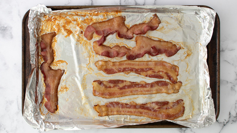 cooked bacon strips on tray