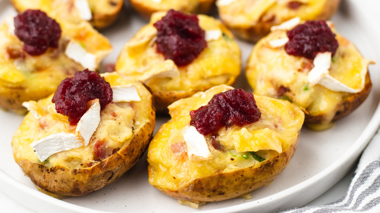 Brie and bacon potato skins on plate