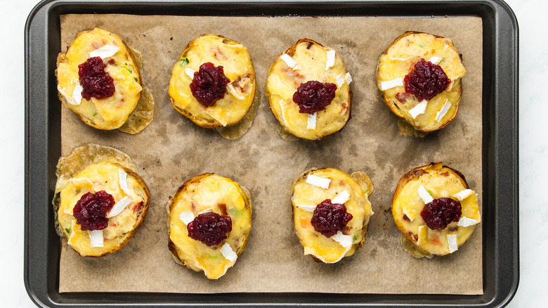 Brie and cranberry potato skins on baking sheet