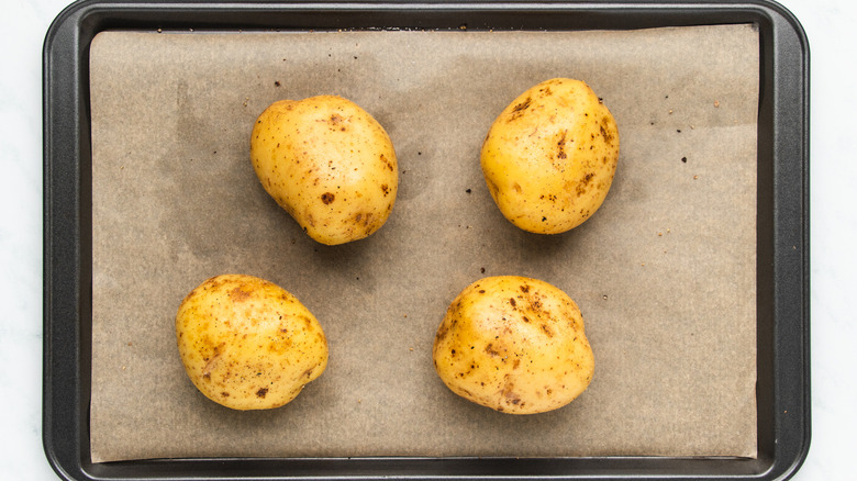 Potatoes on lined baking sheet