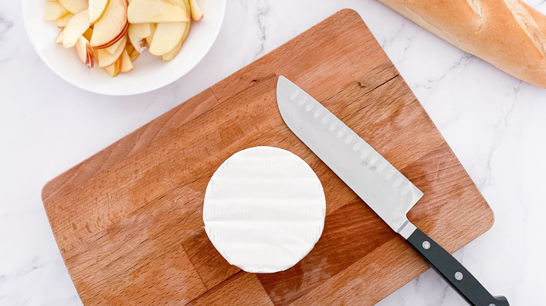 brie cheese on cutting board