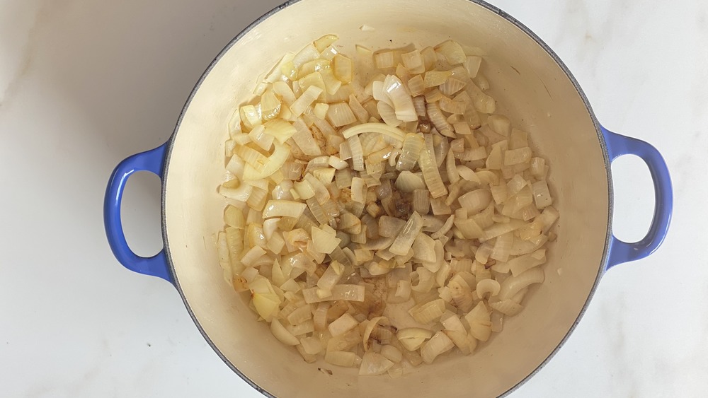 onion sautéeing in Dutch oven for broccoli cheddar soup recipe