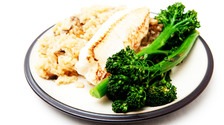 Fish with rice and broccolini