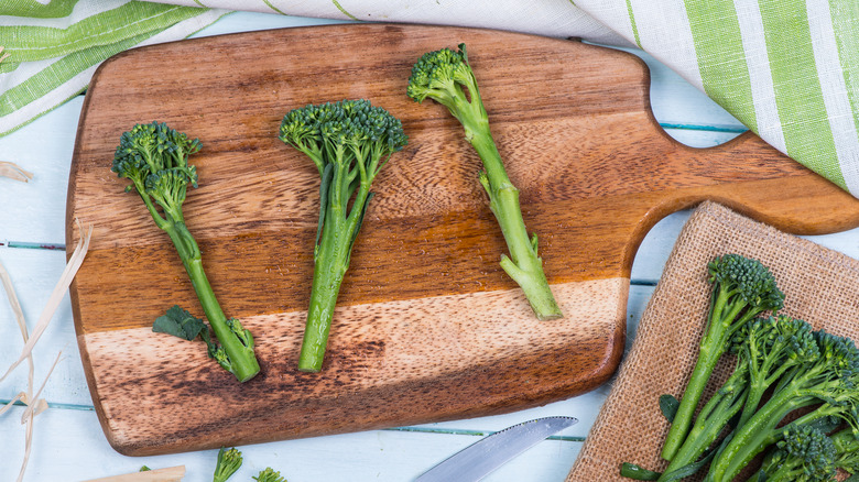 Broccolini on cutting board