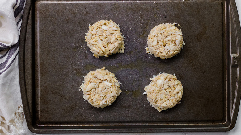 crab cakes on baking sheet