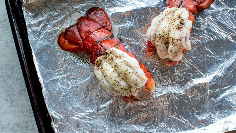 butterflied lobster tails on pan