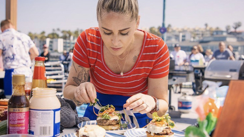 Brooke Williamson plating a dish