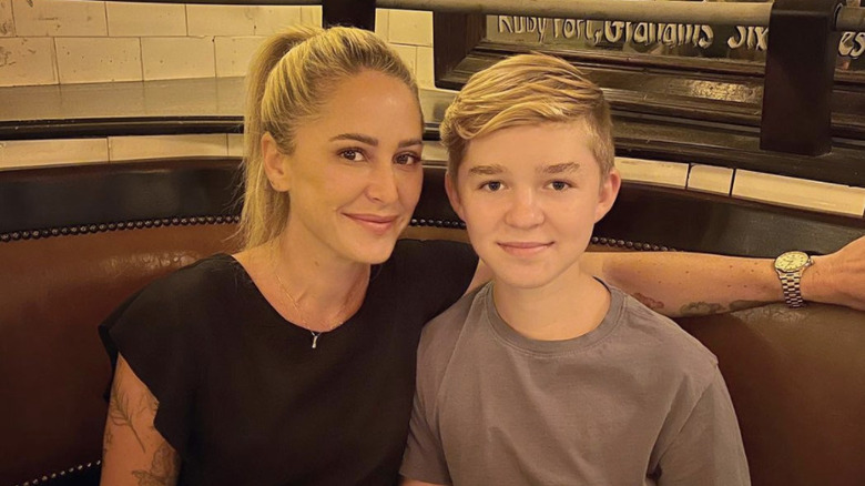 Brooke Williamson posing with her son