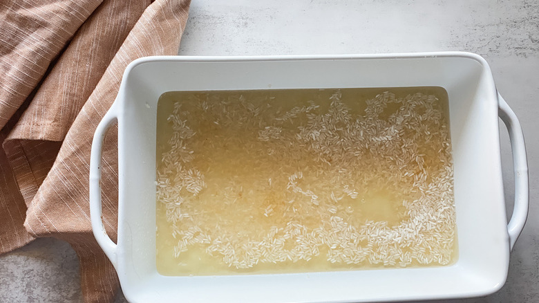 yellow broth in white pan