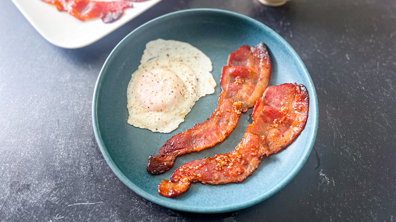 bacon and eggs on plate