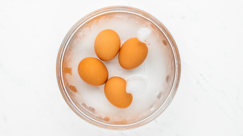 boiled eggs in bowl of ice water