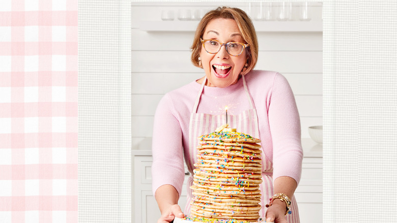 Babs holding stack of pancakes