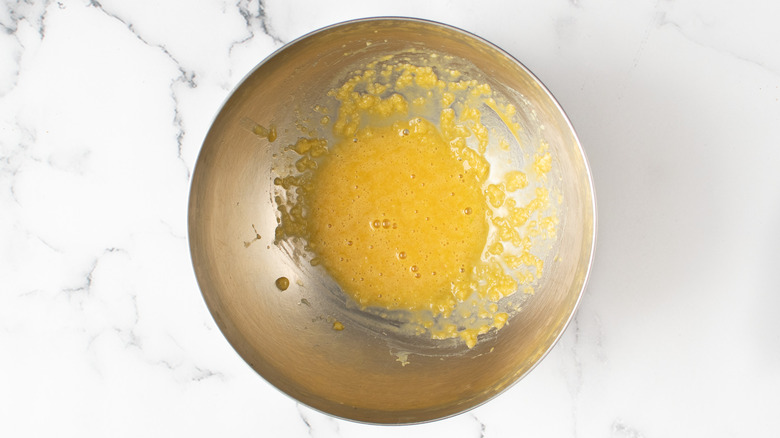 garlic and egg mixture in metal bowl