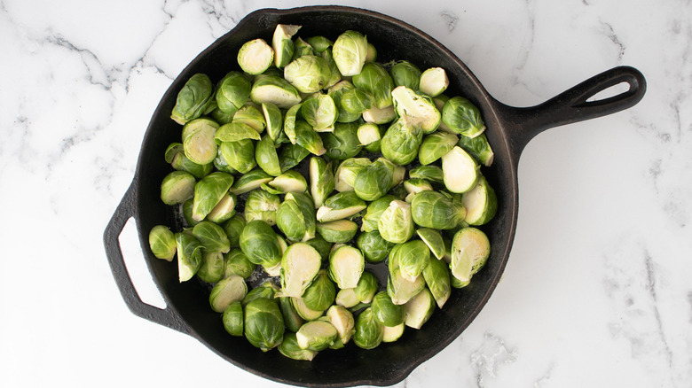 Brussels sprouts in black pan