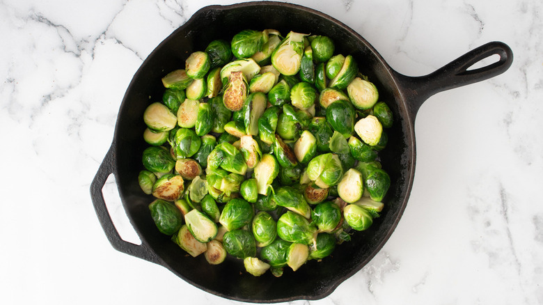 Brussels sprouts in black pan