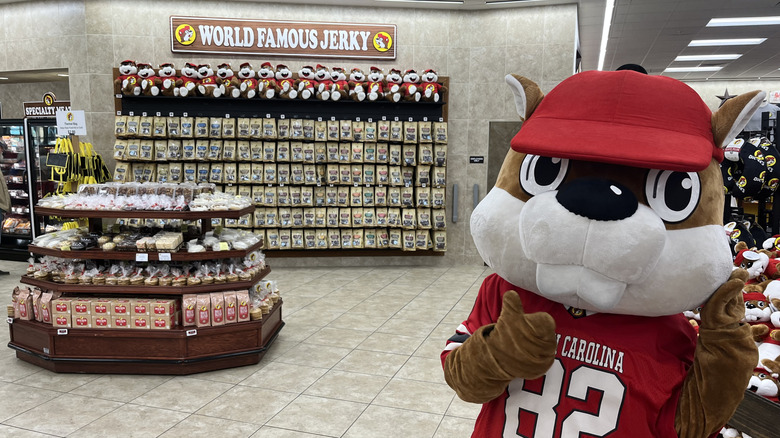 Costumed Buc-ee's mascot employee gesturing toward jerky