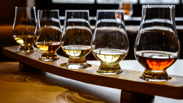 Row of 5 glasses of whiskey for tasting