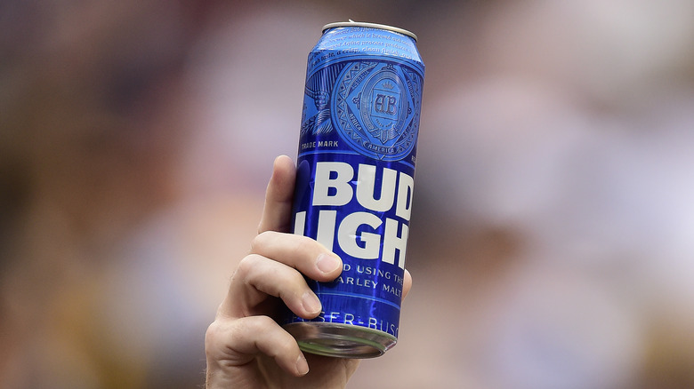 Hand holding Bud Light can