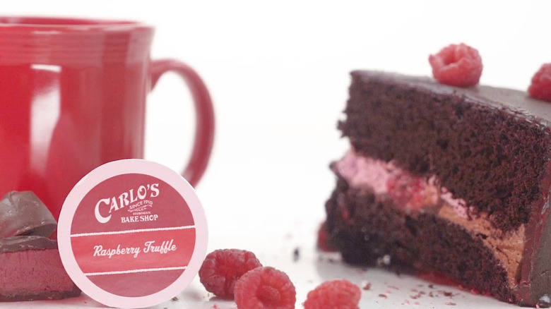 Raspberry Truffle K-Cup coffee pods next to cake