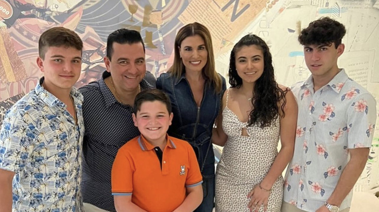 Buddy Valastro posing with family