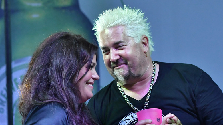 Rachael Ray and Guy Fieri standing together