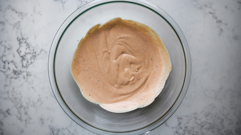 pinkish sauce in clear bowl